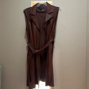 New with tags!! Long vinyl vest size XL